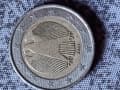 Estimating the Value of a 2002 German 2 Euro Coin