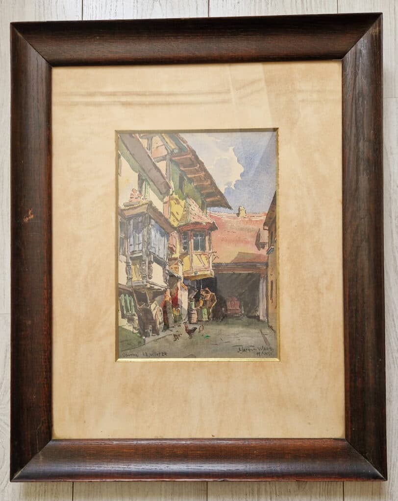 “Estimation de peinture: Aquarelle originale signée par Jean-Jacques Waltz, connu sous le nom de Hansi, datée du 28 Juillet 1929, représentant une rue d’Obernai”