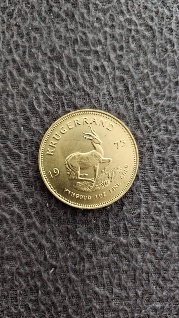 “Estimation d’une pièce d’or Krugerrand datant de 1975 en parfait état sans altérations visibles”