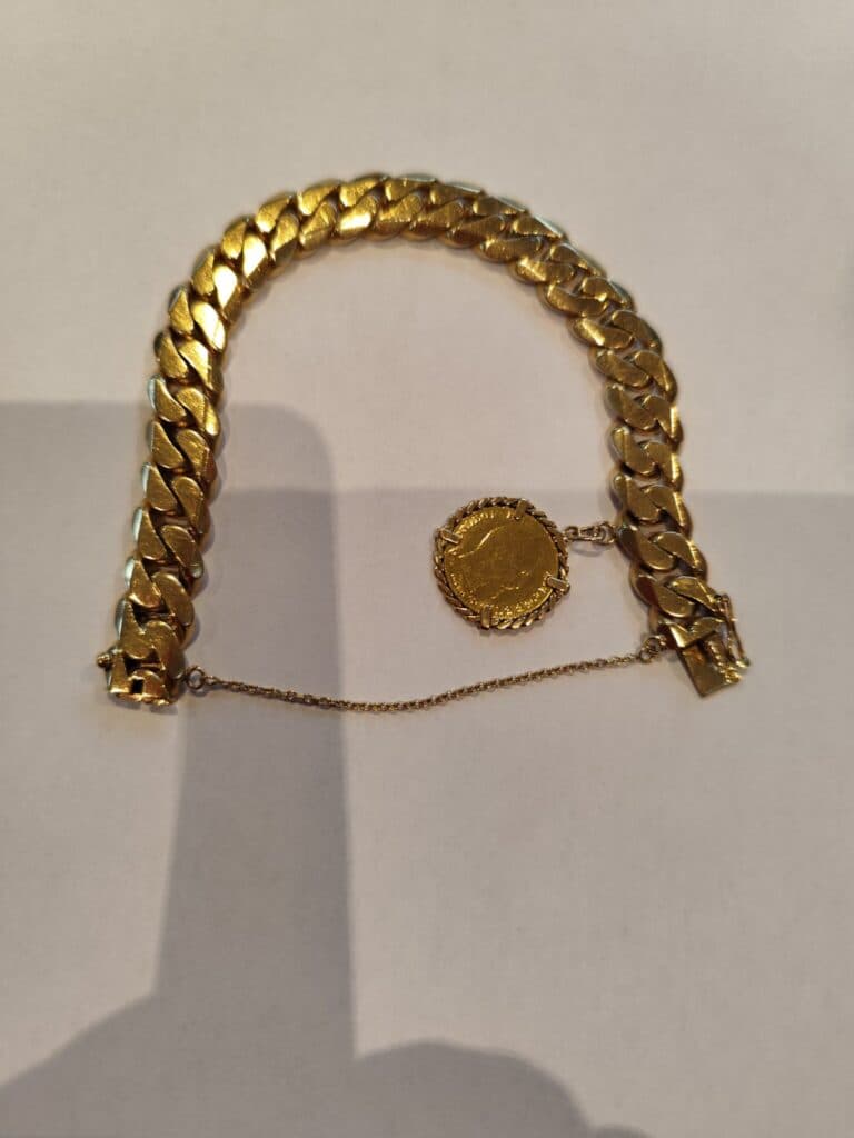 Estimation de valeur pour une gourmette en or de 30g, ornée d’un pendentif pièce Napoléon de 1859 en or 5 francs